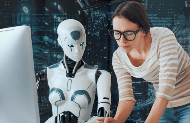 A healthcare professional working with a humanoid AI robot at a computer, representing advancements in AI in healthcare and its role in transforming Electronic Medical Records (EMRs)